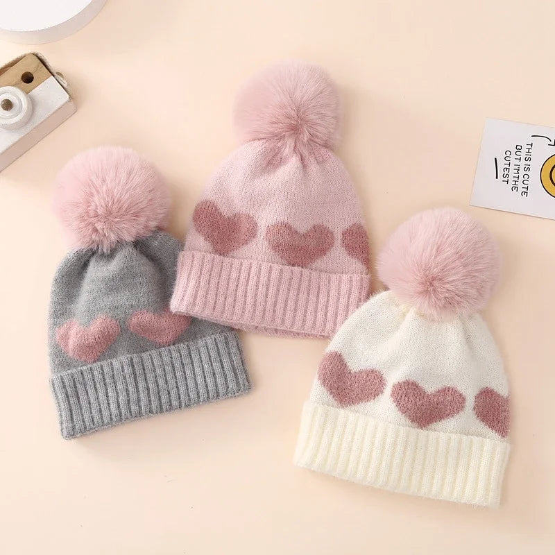 Lioraitiin Baby Girl Winter Hat Cute Heart Pattern Plush Pom Knit Beanie Warm Hospital Cap For Infant Cold Weather Accessories